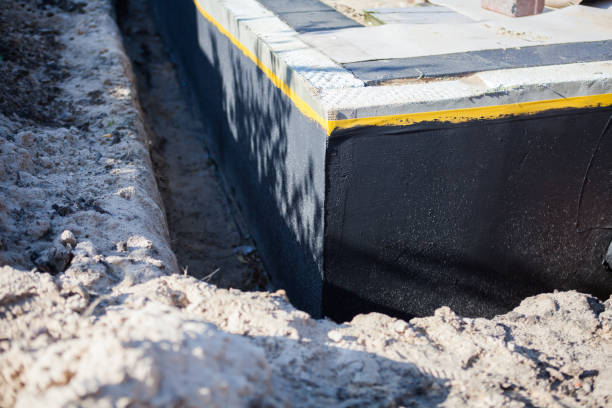 Professional Waterproofing technician working in Fletcher, OH